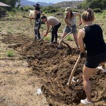 Students preparing a swale to recharge the ground water