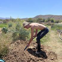 Student preparing a soil mixture to plant seeds