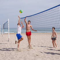 CAMPERS PLAYING BEACH VOLLEY AT IBERIAN CAMPS