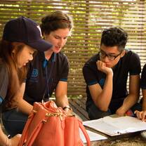 Global MBA students working on a team project