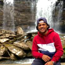 Spirit intern in front of a waterfall