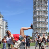Girl posing with tower of Pisa