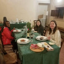 Students enjoying a traditional Italian meal.