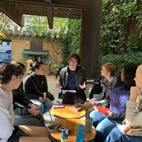 Discussing independent projects as a group in Greenacre Park
