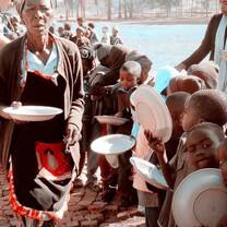 Children wait in line at Feeding program 