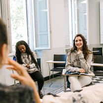 2 students sitting in a classroom