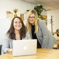 Two interns working at the office
