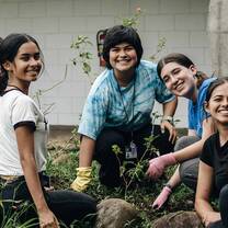 Five students gardening in Costa Rica