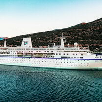 MV World Odyssey sailing into port