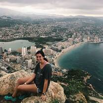 Student on cliff over Alicante