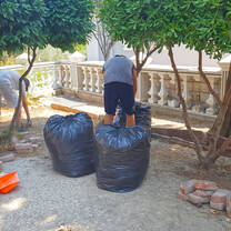 Cleanning the garden of a primary school