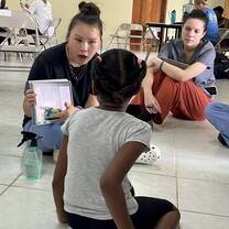 Participant reading to a student