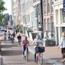 People biking around Amsterdam