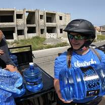 Delivering Water on ATVs