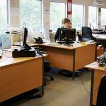 CEA CAPA intern at brown desk working at the Marriott 