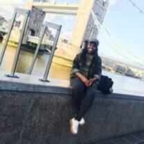 CEA CAPA student sitting on side of bridge