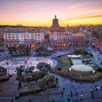 Plaza de Catalunya at sunset in Barcelona, Spain