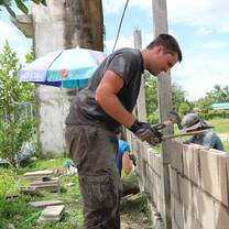 Volunteer with bricks