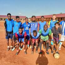 Football volunteers with local players in Accra