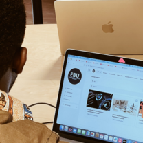 A Man Seated Using His Laptop to Login Into EBU's Campus Portal 