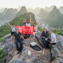 young people after a hike on top of a mountain in guilin