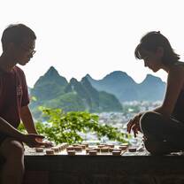 two people playing go in guilin