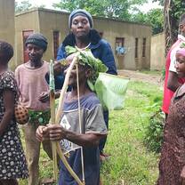The photo was taken when the environmental conservation club visited the Pygmies of Bundibugyo in western Uganda 