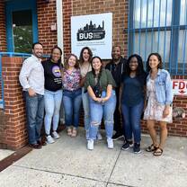 Students and Staff in front of the Baltimore Urban Studies building