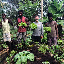 4 people with vegetable harvest