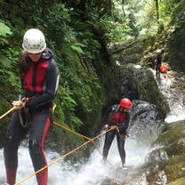 Rappelling down a waterfall during a hike
