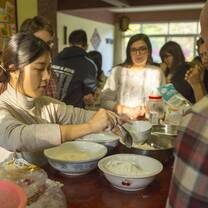 chinese and western people cooking dumplings