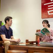 student and teacher learning chinese