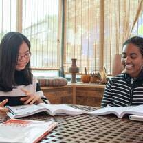 student and teacher learning chinese