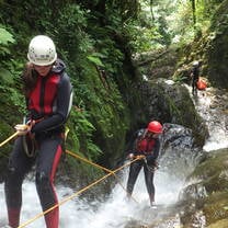 Rappelling down a waterfall during a hike