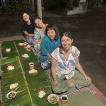 Volunteers eating a traditional Megibung