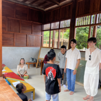 Volunteers in class teaching students 