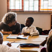 Founder of Surfpop, Daniel, helping during an education session.