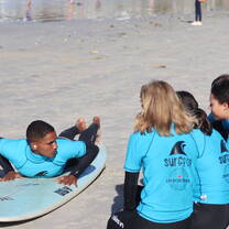 Volunteers getting a lesson by instructor Wade.