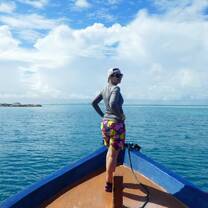 Tourist on the bow of a Maldives dhoni