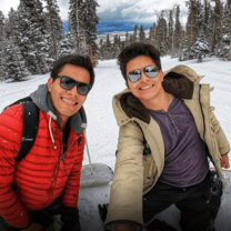 Two young men on ski slope