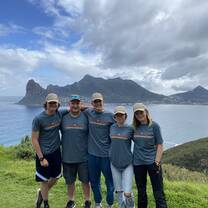 Students pose in front of the backdrop of Cape of Good Hope