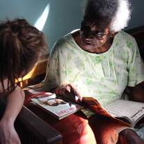 Volunteer engaging with elderly community member