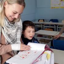 Volunteer at work with children