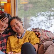 Two happy karma yogis bonding on the couch