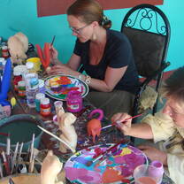 Intern in Oaxaca, Mexico creating artwork and painting as part of their volunteer or internship program