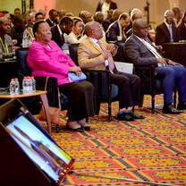 Attendees at an event sitting in a conference hall