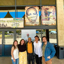 Students posing with Mac Maharaj
