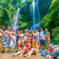 Backpacking Bali group in front of waterfall
