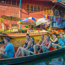 Backpacking Thailand group in a canoe