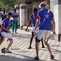 Volunteers and asylum seekers play football together